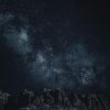 Star-filled night sky over mountains Starry sky with Milky Way over mountains